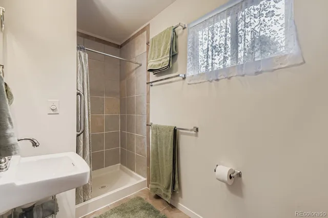 a bathroom with a bathtub and a sink