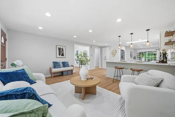 a living room with furniture and a table