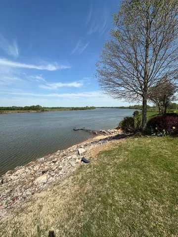 a view of a lake with a yard