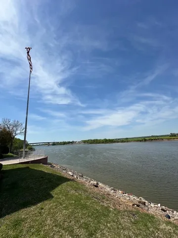 a view of a lake with a big yard