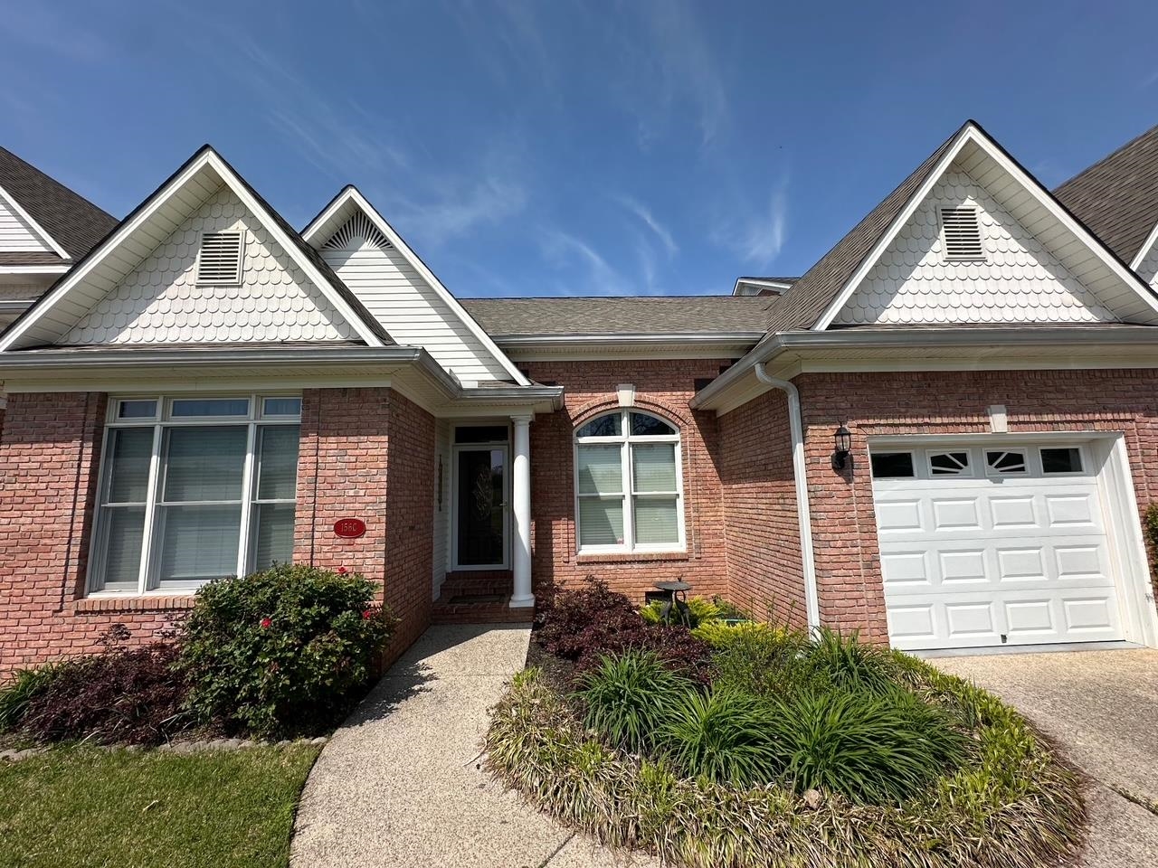 156 C Aquatic View Way Savannah, TN 38372 - Photo 20 of 23 a front view of a house with garden