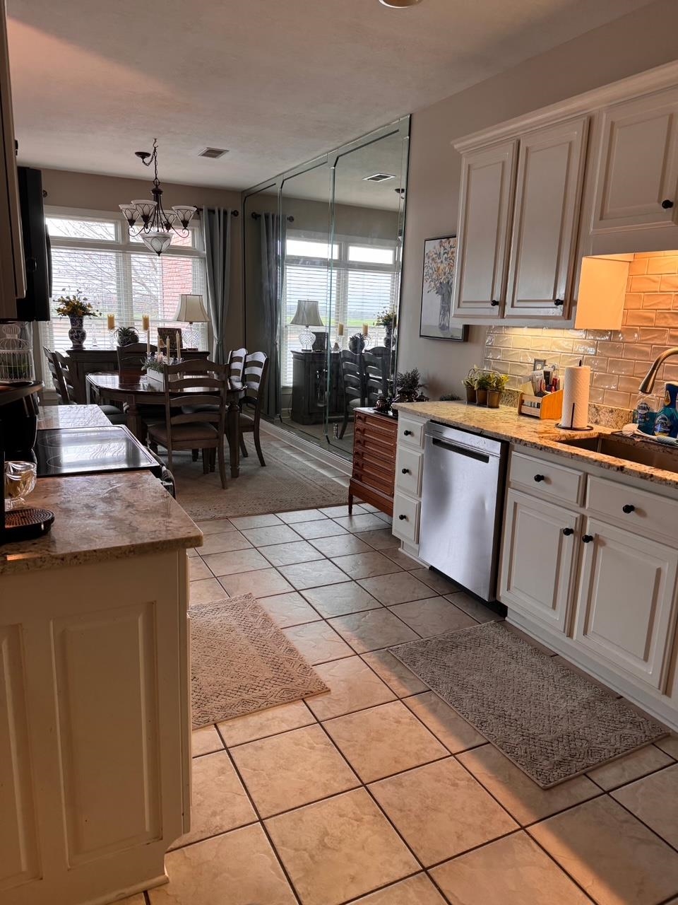 156 C Aquatic View Way Savannah, TN 38372 - Photo 2 of 23 a kitchen with counter top space cabinets appliances and a window