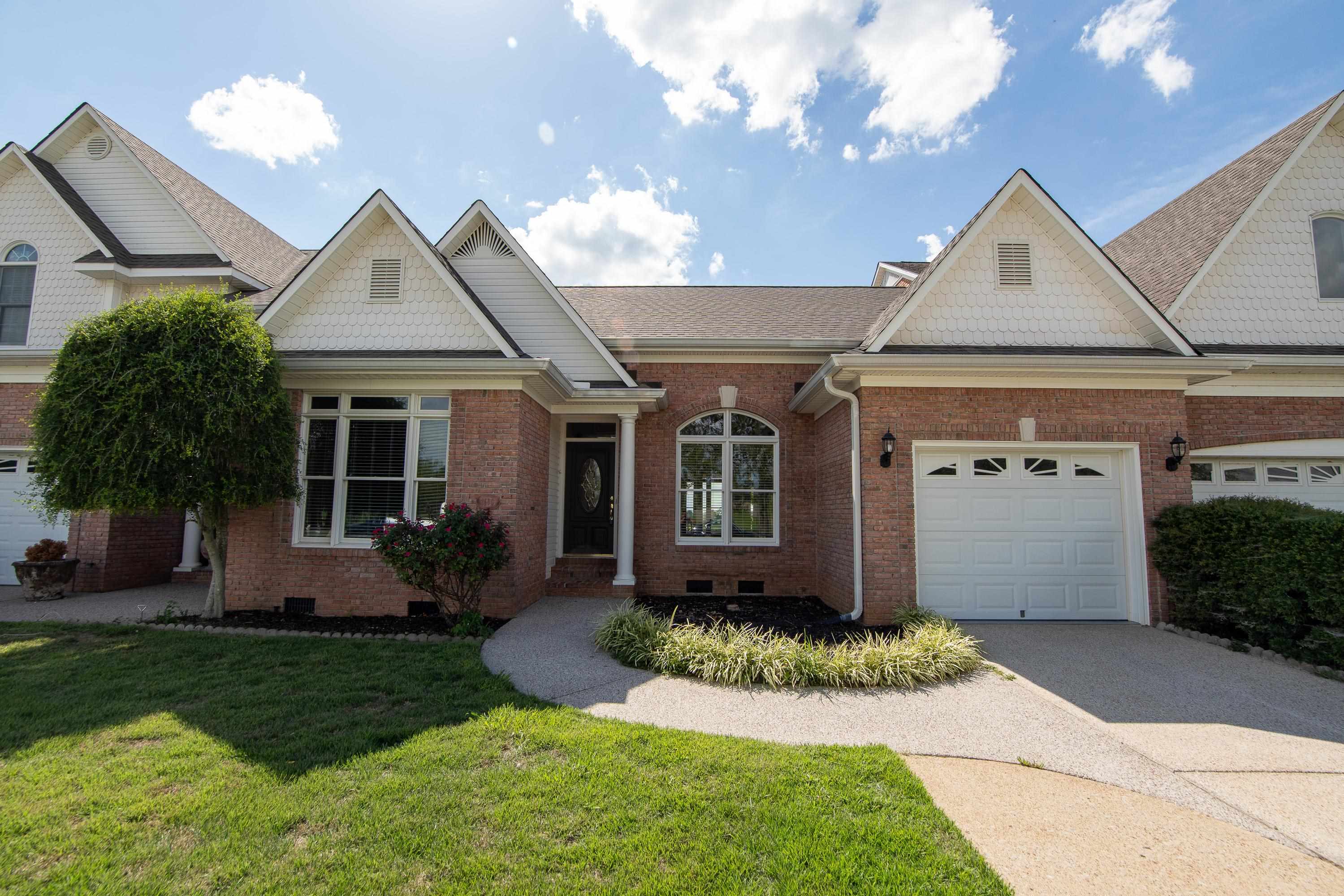156 C Aquatic View Way Savannah, TN 38372 - Photo 21 of 23 a front view of a house with a yard and porch
