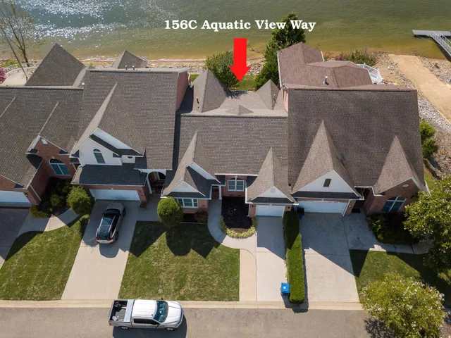 an aerial view of houses with outdoor space