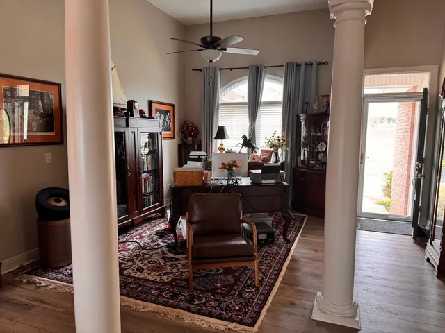 a view of a dining room with furniture window and wooden floor