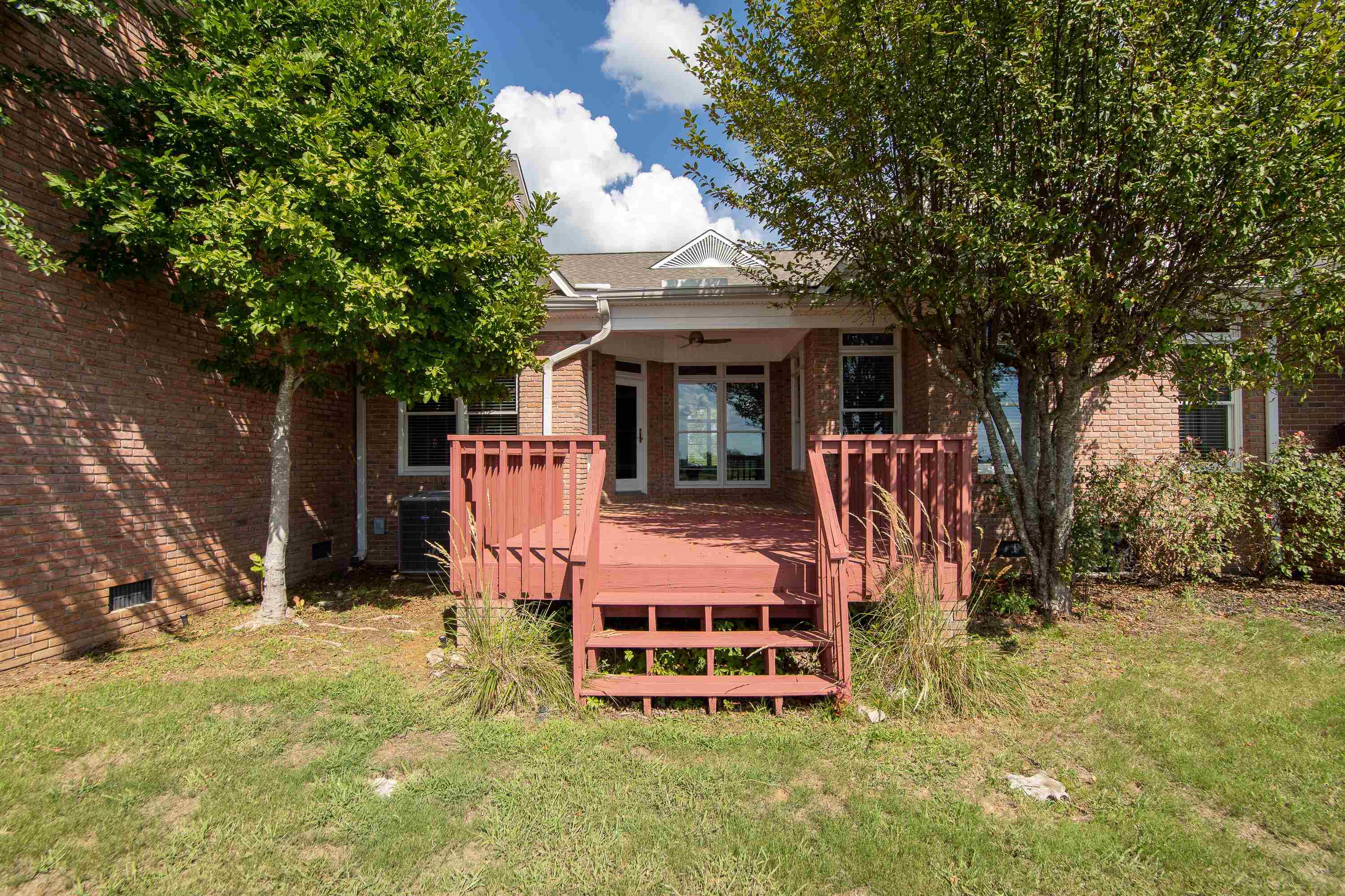 156 C Aquatic View Way Savannah, TN 38372 - Photo 9 of 23 a view of a wooden chairs and bench in the yard