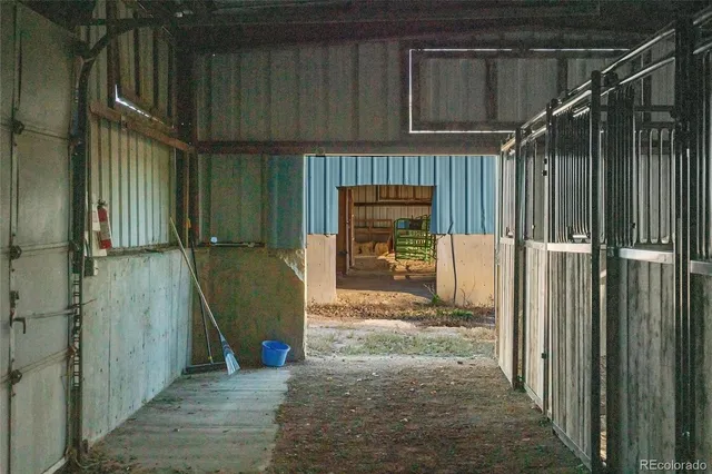 a view of backyard with deck and outdoor seating
