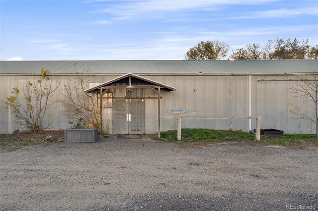 a view of empty room with wooden walls