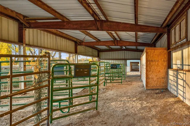 a front view of a house with a garden and yard