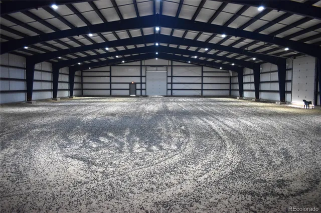 a kitchen with stainless steel appliances granite countertop a sink window and wooden floor