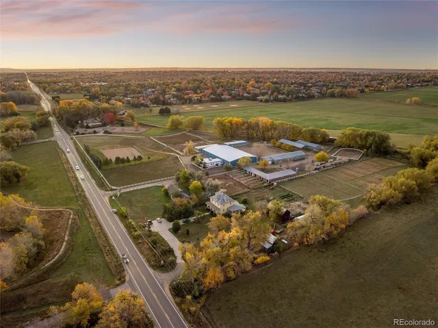 an aerial view of a residential houses with outdoor space