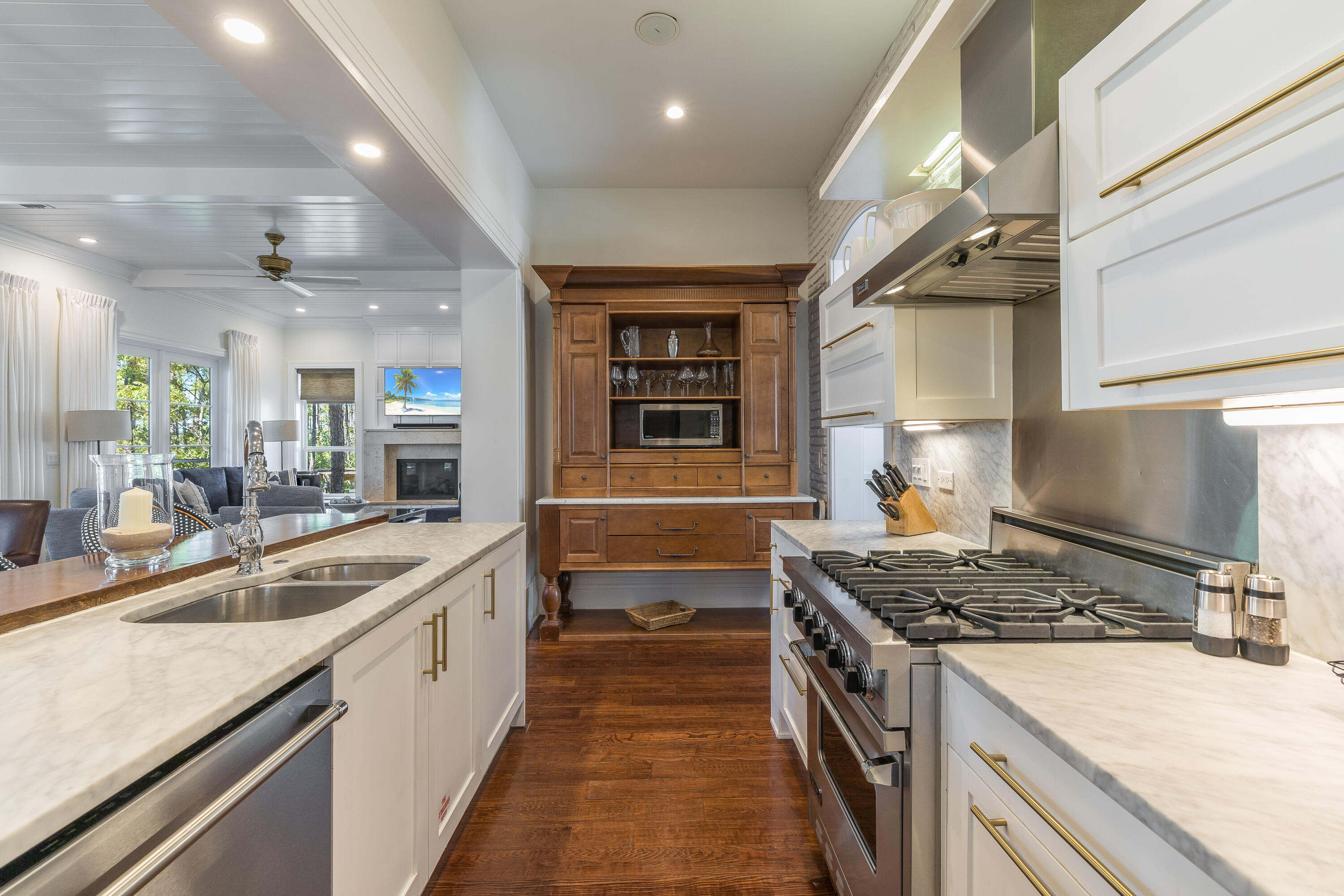 8115 Inspiration Drive, Unit C2 Sandestin, FL 32550 - Photo 14 of 44 a kitchen with a stove sink and cabinets