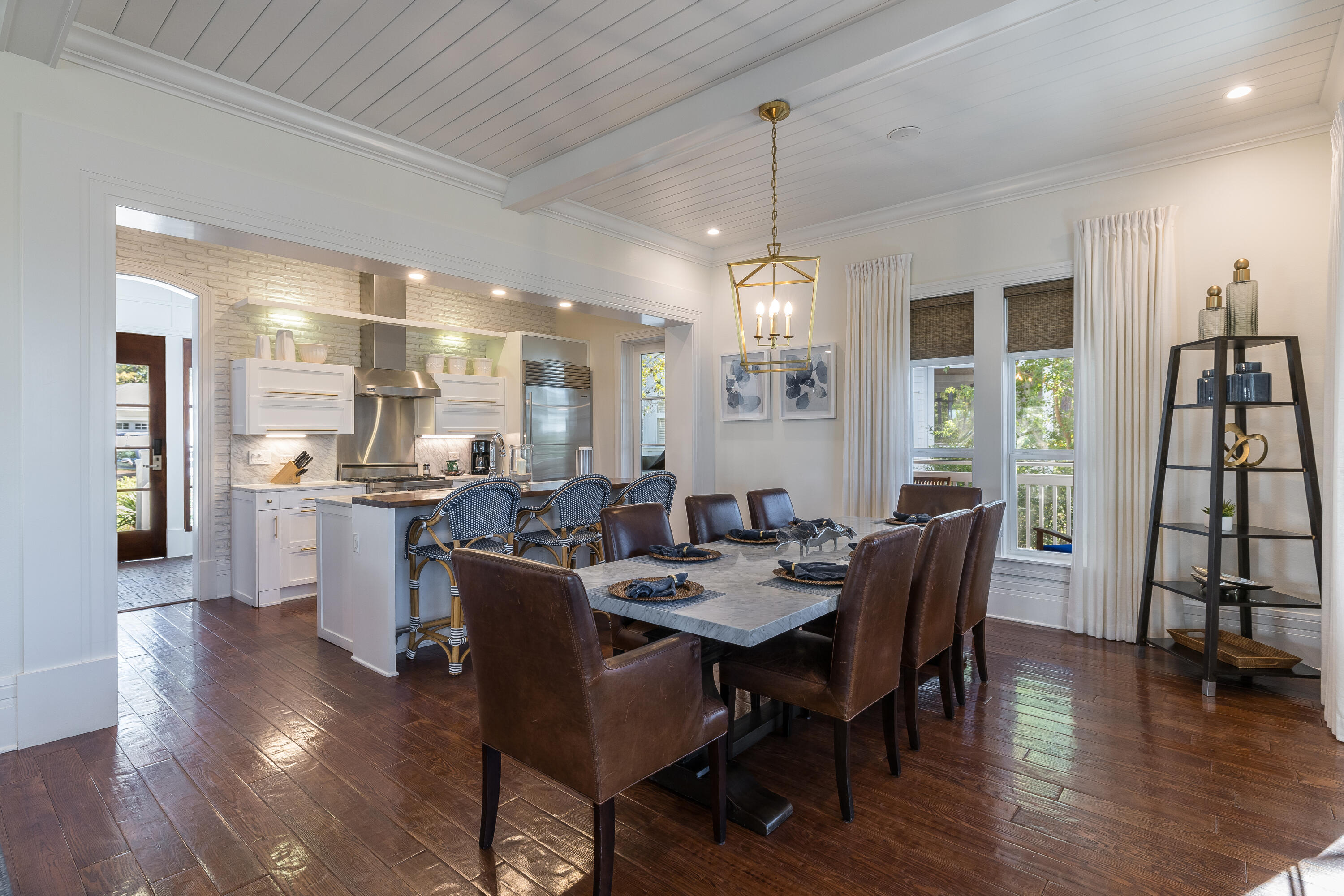8115 Inspiration Drive, Unit C2 Sandestin, FL 32550 - Photo 16 of 44 a view of a dining room with furniture window and wooden floor