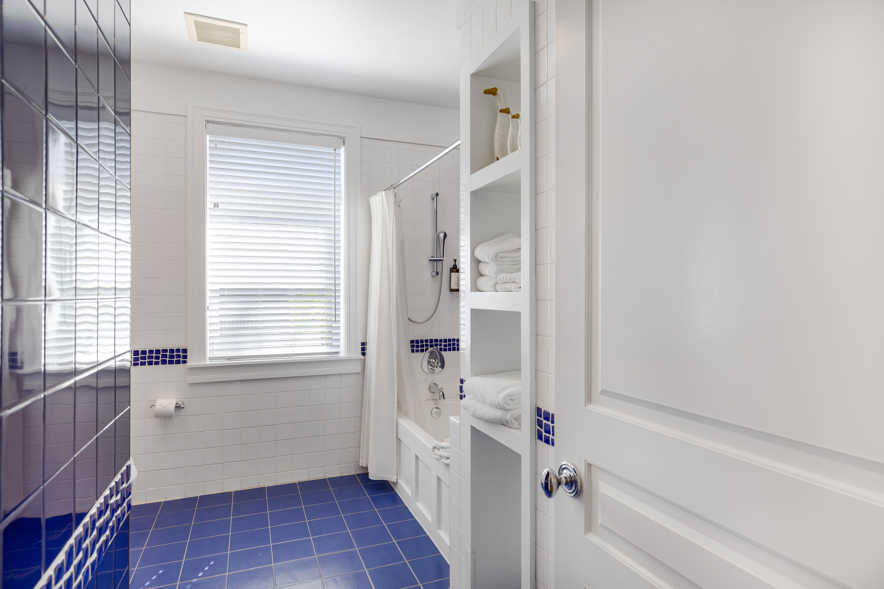 8115 Inspiration Drive, Unit C2 Sandestin, FL 32550 - Photo 23 of 44 a bathroom with a bathtub and a shower