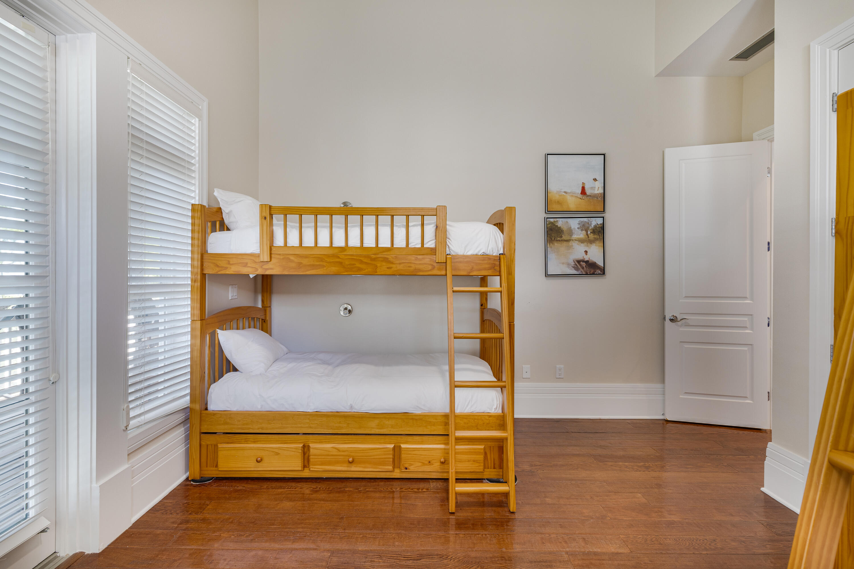 8115 Inspiration Drive, Unit C2 Sandestin, FL 32550 - Photo 26 of 44 a bedroom with a bed and a table