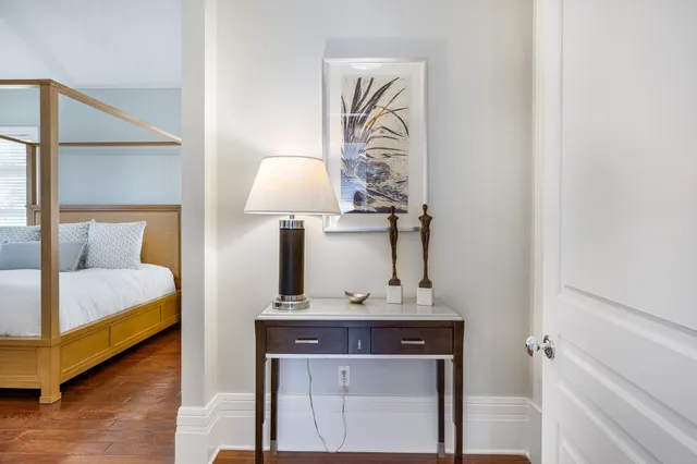 a bed room with a bed and a table