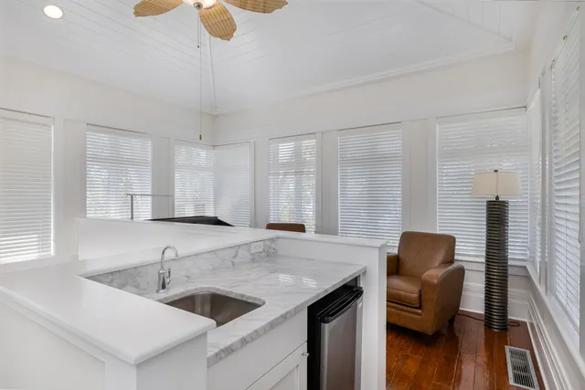 a kitchen with stainless steel appliances granite countertop a sink and a wooden cabinets