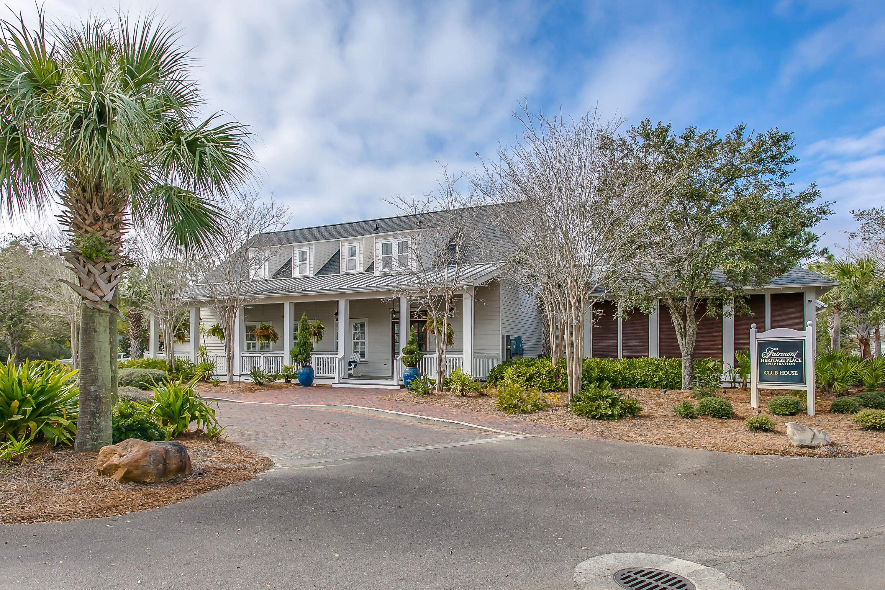 8115 Inspiration Drive, Unit C2 Sandestin, FL 32550 - Photo 38 of 44 a front view of a building with tree s