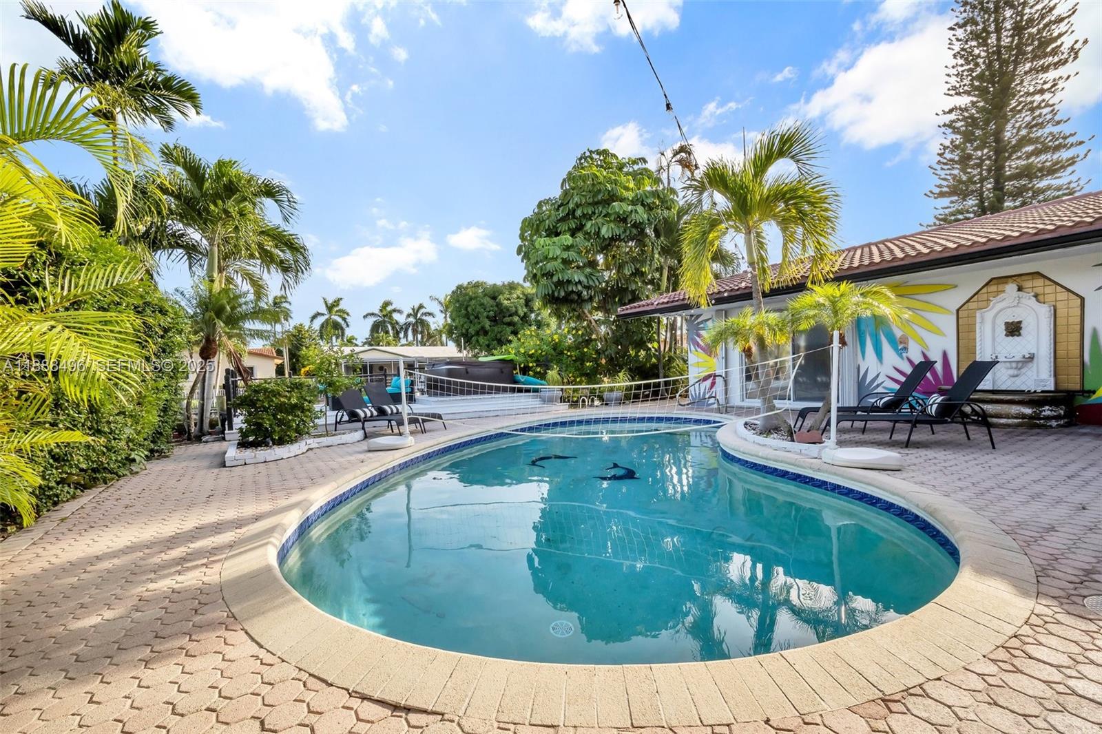 5830 Northeast 14th Road Fort Lauderdale, FL 33334 - Photo 37 of 46 a view of a swimming pool with a patio