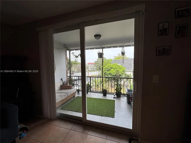 a room with window and pool view