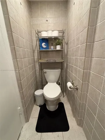 a kitchen with a table and chairs in it