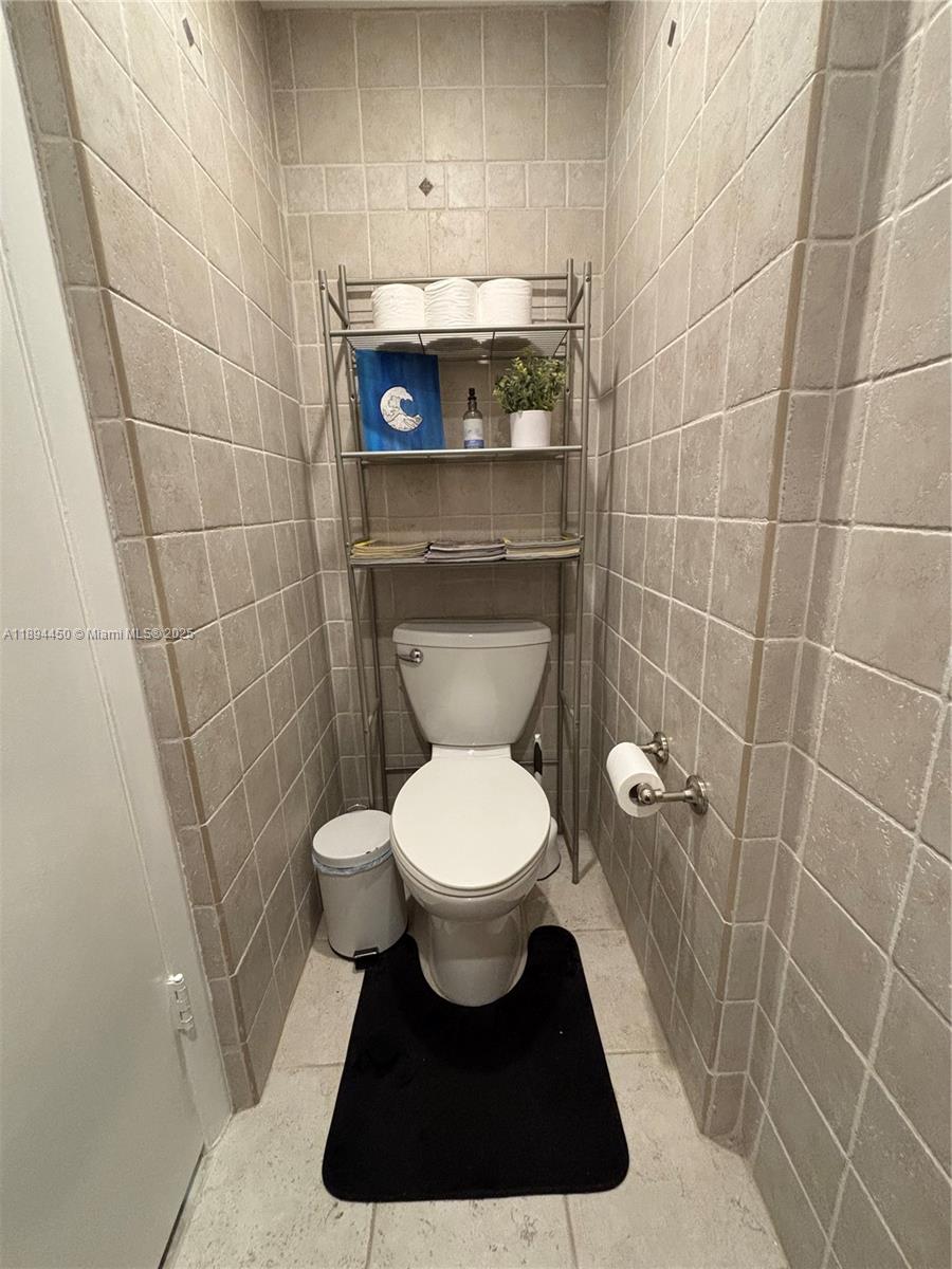 3650 Inverrary Drive, Unit 3YG Lauderhill, FL 33319 - Photo 29 of 38 a bathroom with a toilet and a sink