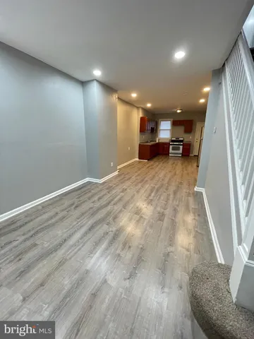 a view of a living room with a wooden floor