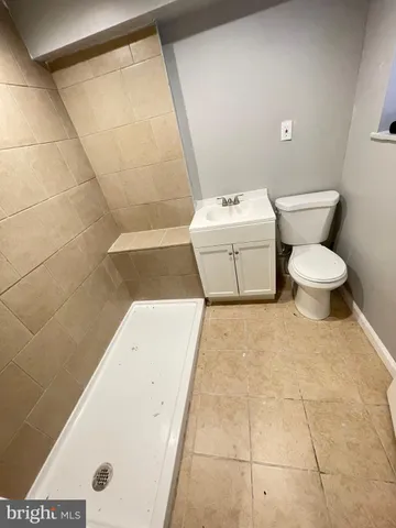 a bathroom with a sink a toilet and a bathtub