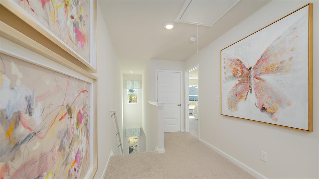 2078 Moss Hill Road Stone Mountain, GA 30083 - Photo 21 of 37 a view of a hallway with paintings on the wall