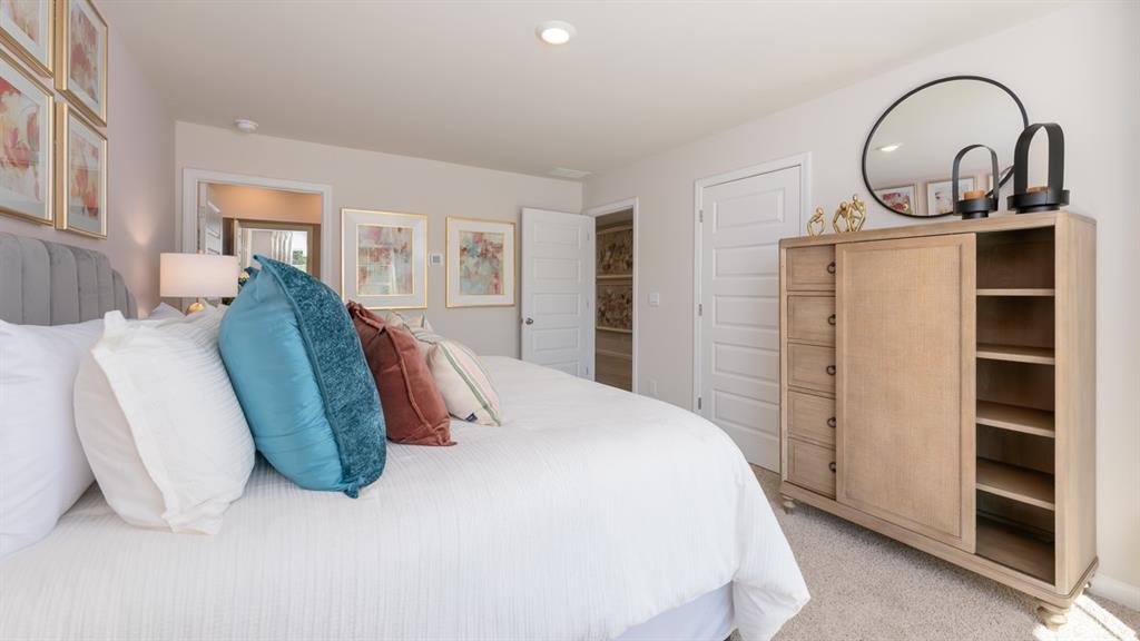 2078 Moss Hill Road Stone Mountain, GA 30083 - Photo 28 of 37 a spacious bedroom with bed and a window
