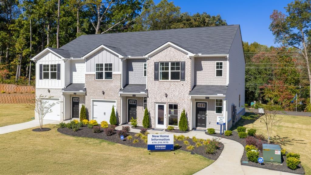 2078 Moss Hill Road Stone Mountain, GA 30083 - Photo 3 of 37 a view of a white house with large windows and couches chairs
