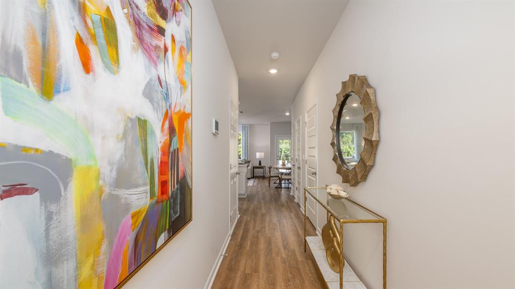 2078 Moss Hill Road Stone Mountain, GA 30083 - Photo 10 of 37 a view of a hallway with wooden floor and staircase