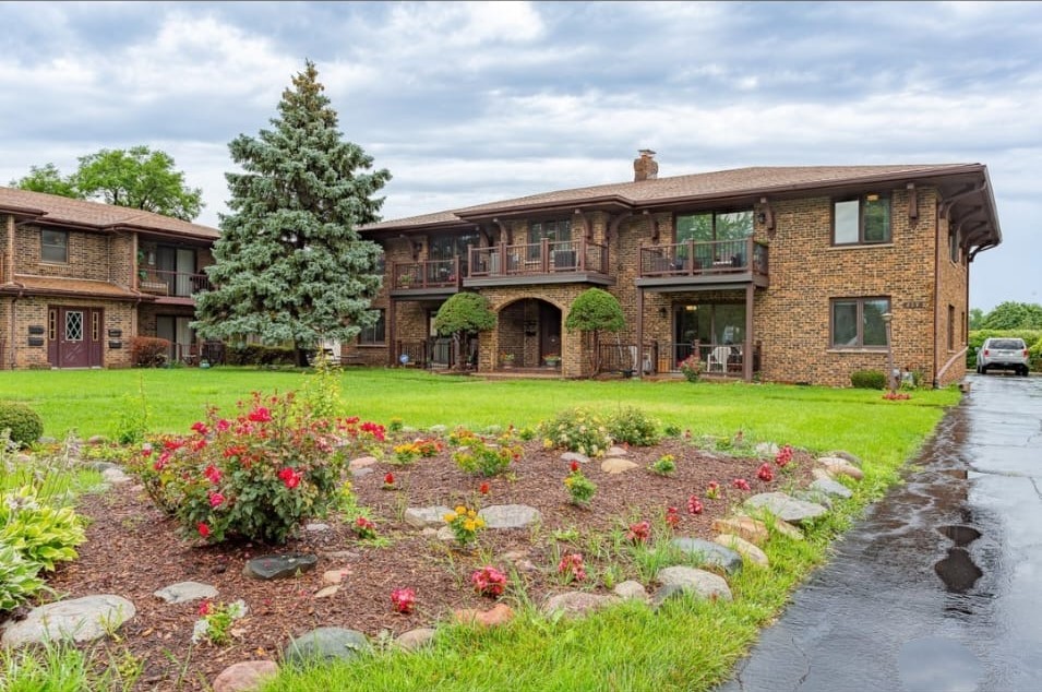 209 East Irving Park Road, Unit 1N Itasca, IL 60143 - Photo 1 of 30 a view of a house with a swimming pool