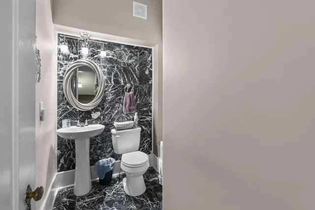 a living room with fireplace furniture and a flat screen tv