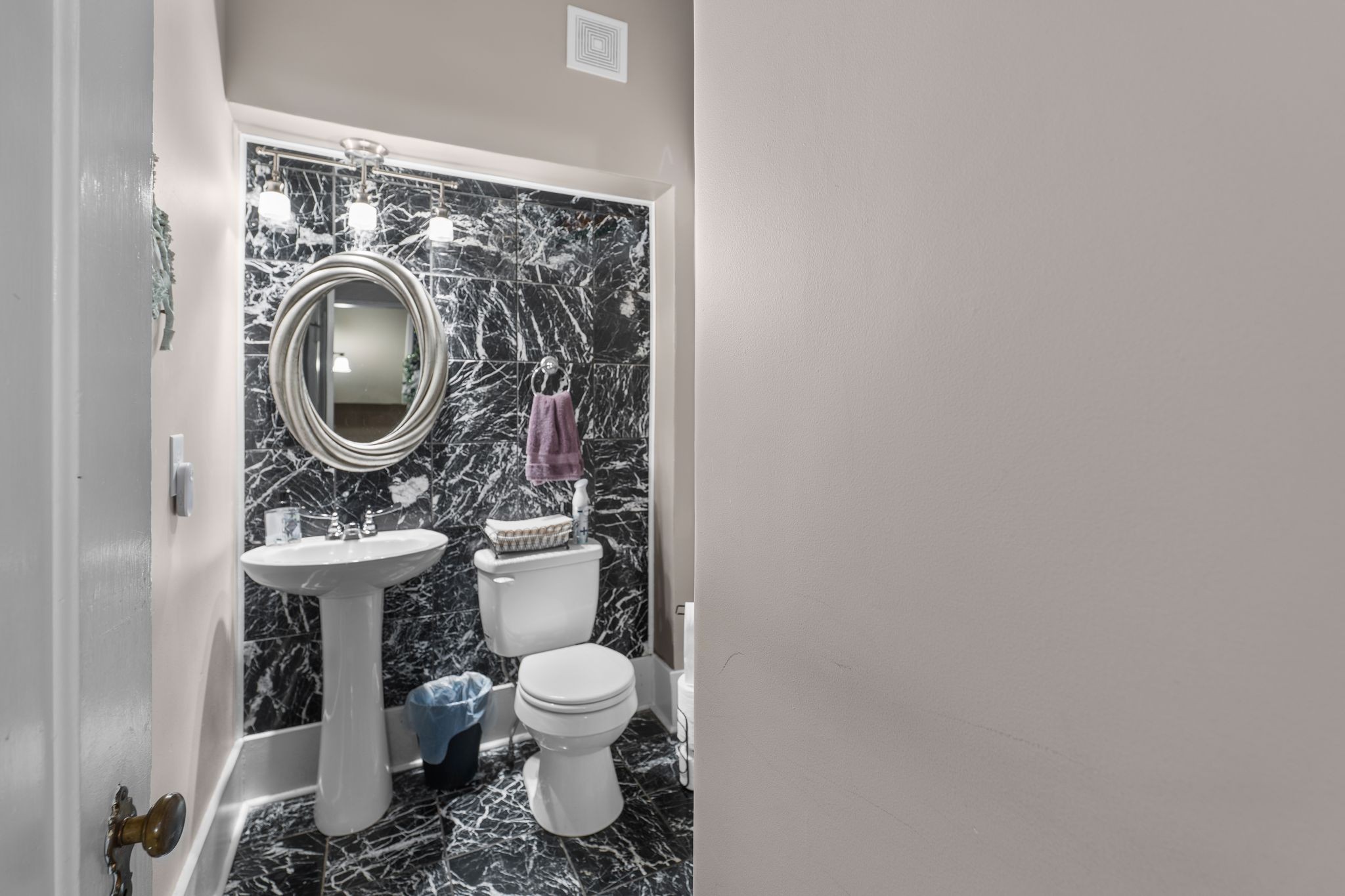 564 East Main Street Jackson, TN 38301 - Photo 19 of 54 a bathroom with a sink a toilet and a mirror