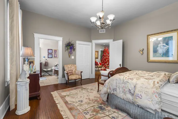 a living room with furniture a fireplace and a floor to ceiling window