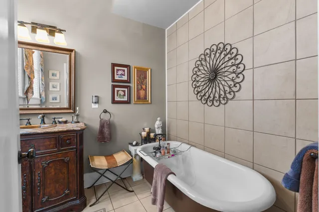 a living room with furniture or couch and a potted plant