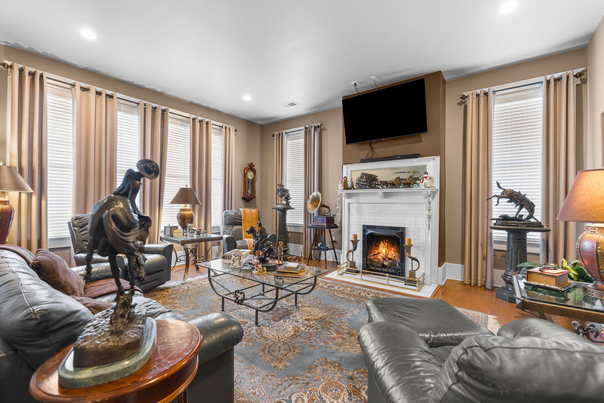 564 East Main Street Jackson, TN 38301 - Photo 26 of 54 a living room with furniture a fireplace and a floor to ceiling window
