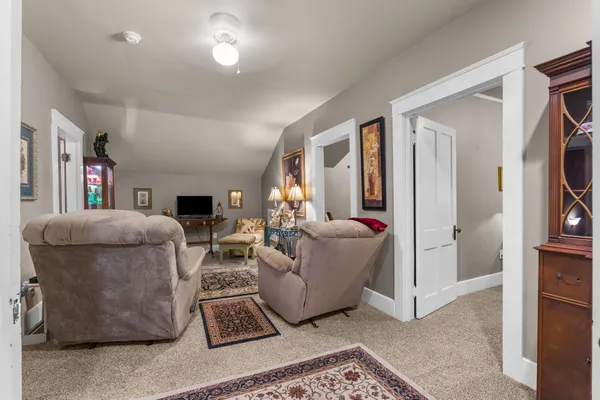 a bedroom with bed and a furniture