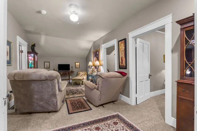 a bedroom with bed and a furniture