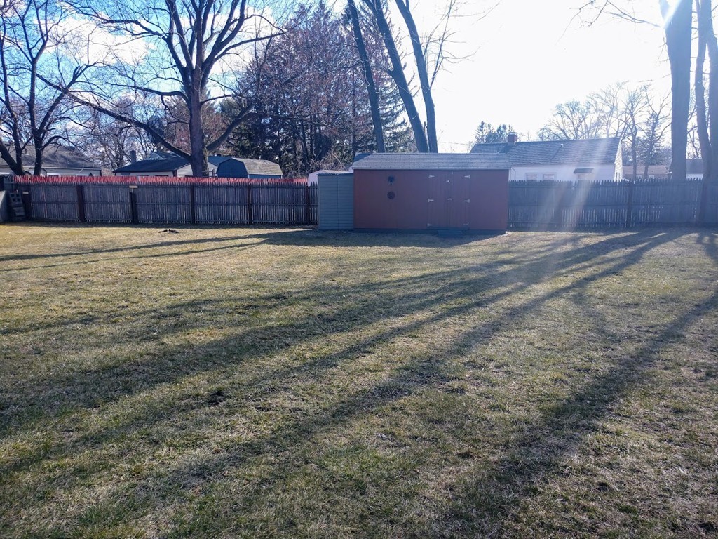 57 Ramah Street Springfield, MA 01104 - Photo 3 of 17 a big yard with wooden fence