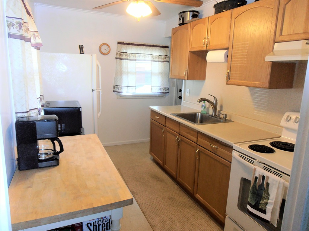 57 Ramah Street Springfield, MA 01104 - Photo 4 of 17 a kitchen that has a sink and a stove