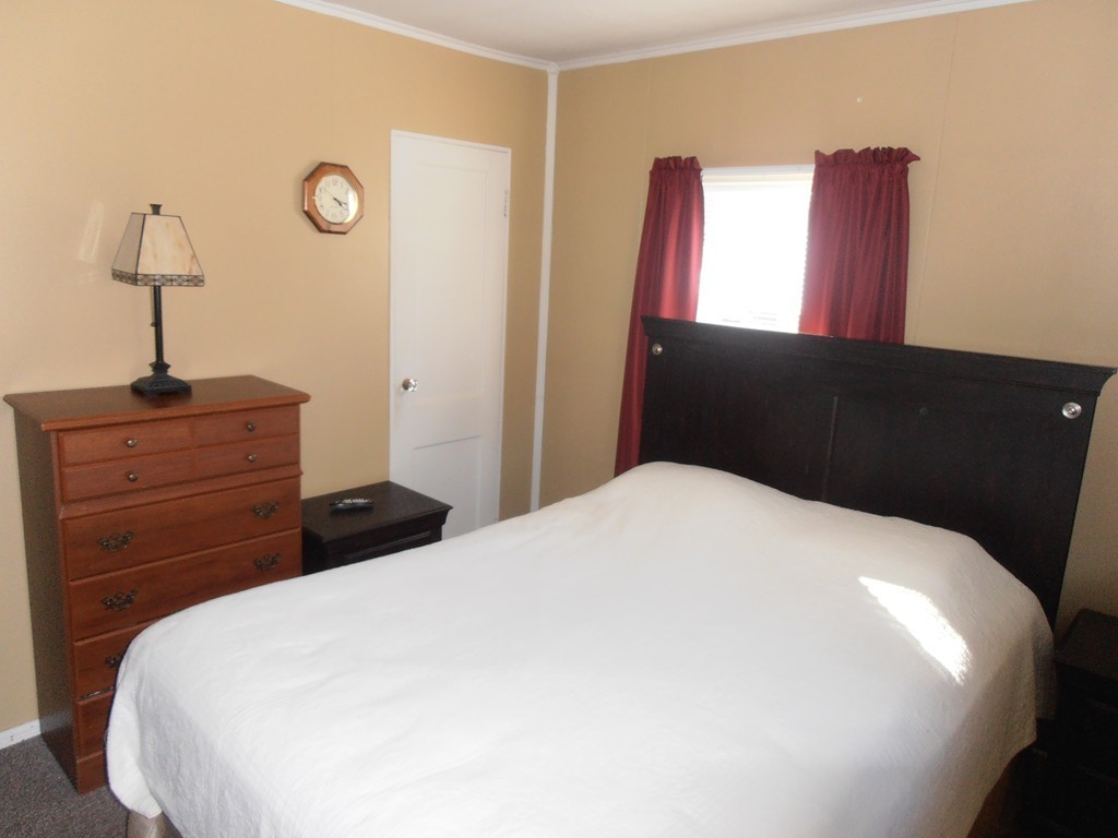 57 Ramah Street Springfield, MA 01104 - Photo 9 of 17 a bedroom with a bed and a dresser