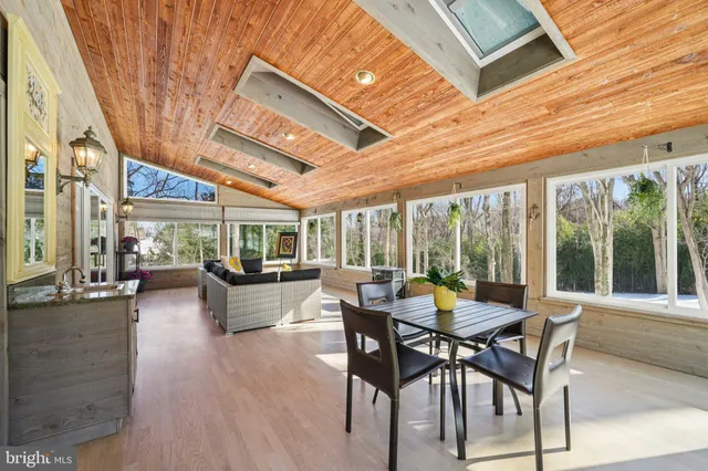 a view of a patio with table and chairs