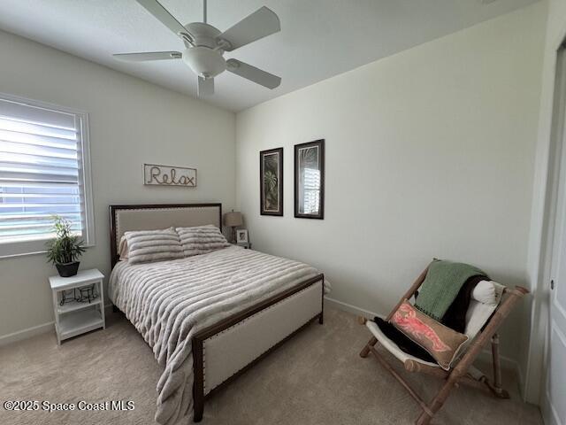 2115 Trift Bridge Circle Melbourne, FL 32940 - Photo 13 of 34 a bedroom with a bed and a chair
