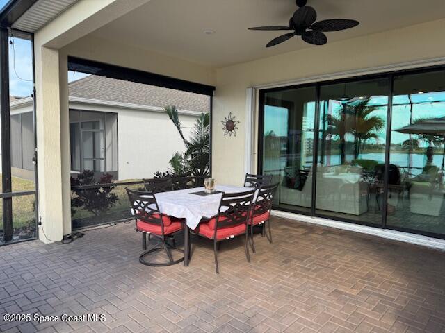 2115 Trift Bridge Circle Melbourne, FL 32940 - Photo 23 of 34 a patio with table and chairs