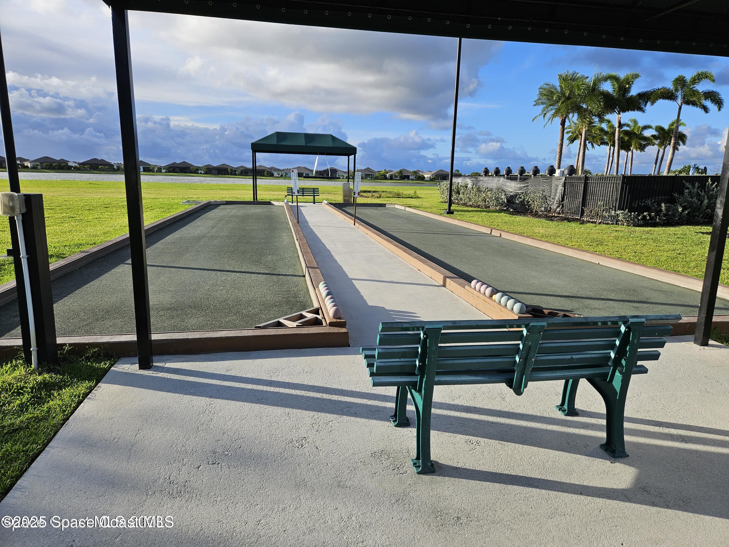 2115 Trift Bridge Circle Melbourne, FL 32940 - Photo 33 of 34 a view of a swimming pool with a lounge chairs