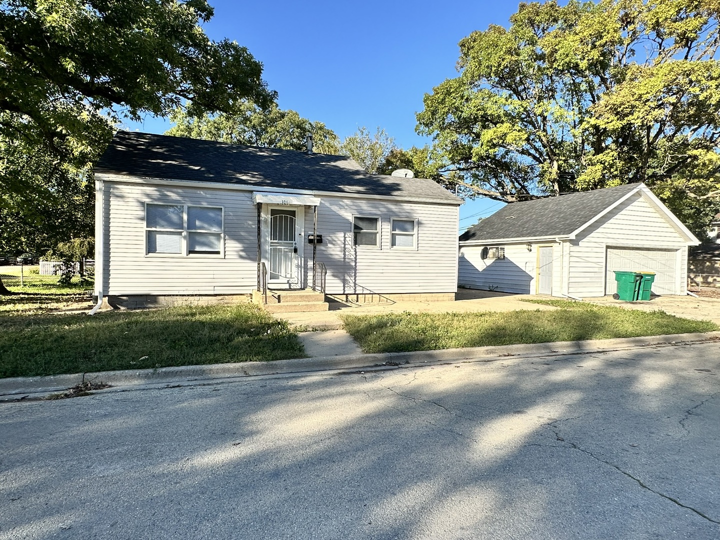 1061 Cottage Place Joliet, IL 60436 - Photo 1 of 21 a front view of a house with a yard and garage