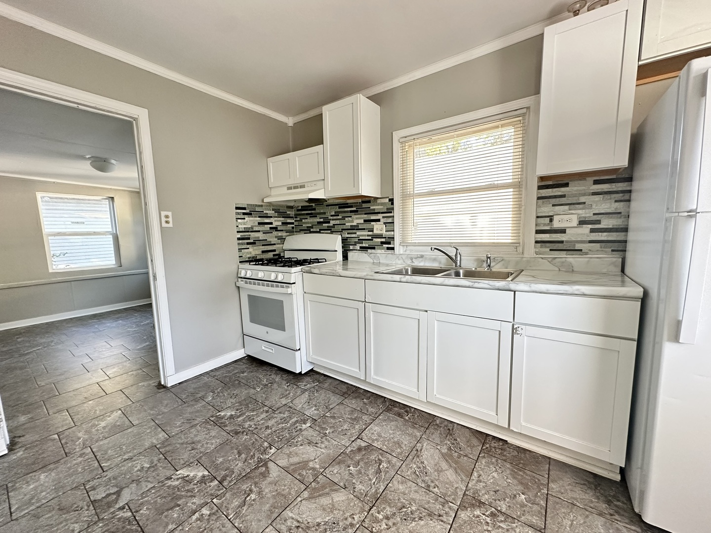 1061 Cottage Place Joliet, IL 60436 - Photo 12 of 21 a kitchen with stainless steel appliances a sink a stove a refrigerator and cabinets