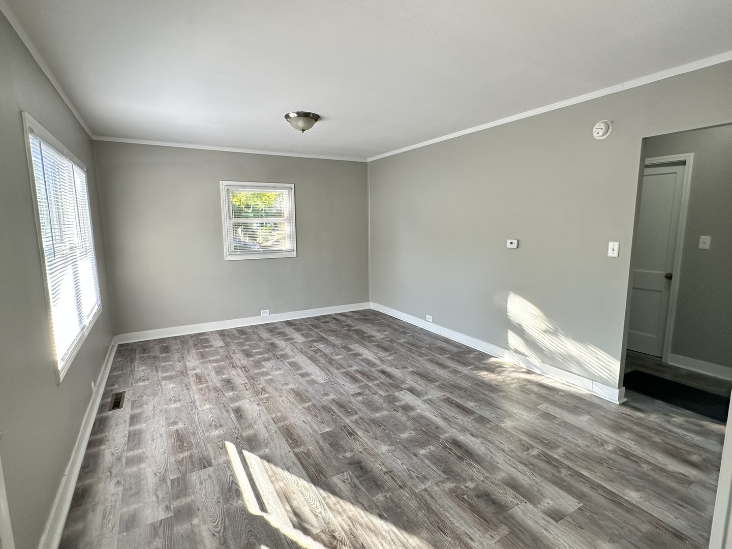 1061 Cottage Place Joliet, IL 60436 - Photo 4 of 21 a view of empty room with wooden floor and fan